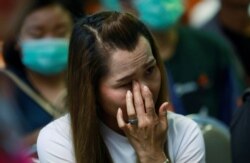 A supporter of Future Forward Party cries at the party's headquarters in Bangkok, Thailand, Feb. 21, 2020.
