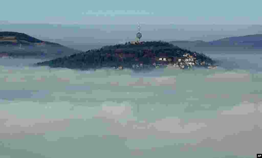 The Bosnian capital of Sarajevo is seen covered by layers of fog.