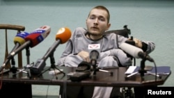 FILE - Valery Spiridonov, who has volunteered to be the first person to undergo a head transplant, attends a news conference in Vladimir, Russia, June 25, 2015. 