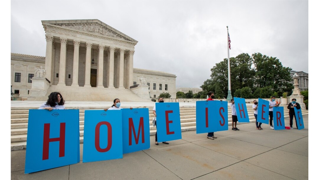 FILE - In this June 18, 2020, photo, Deferred Action for Childhood Arrivals (DACA) students protest in front of the Supreme Court in Washington.