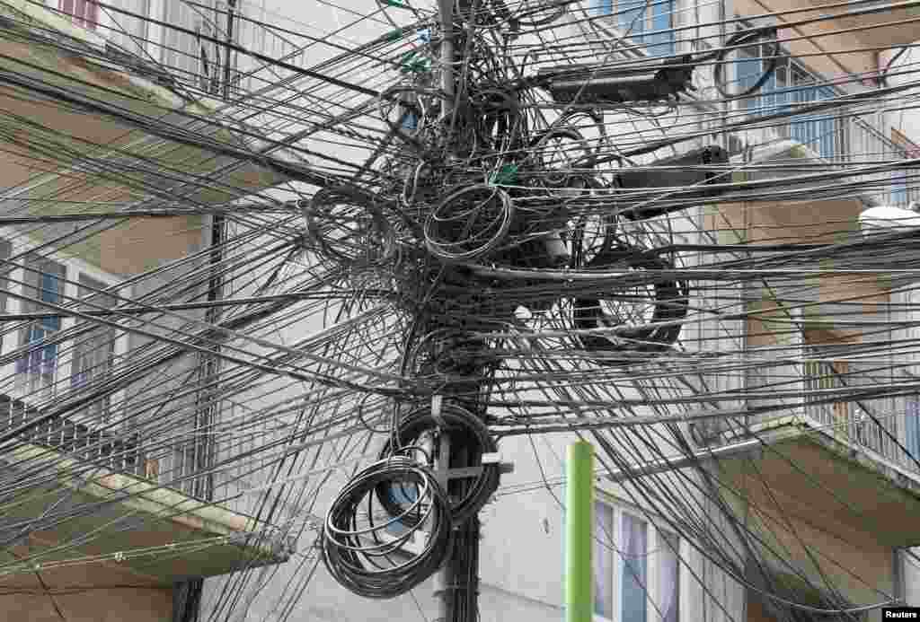 Electric and communication wires are seen in the center of La Paz, Bolivia.