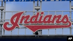 The Indians sign hangs at Progressive Field before the first baseball game of a doubleheader against the Chicago White Sox, Sept. 23, 2021, in Cleveland.