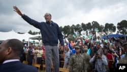 FILE - In this Saturday, Sept. 5, 2015 file photo, Rwanda's President Paul Kagame waves to the crowd before speaking at a baby gorilla naming ceremony in Kinigi, northern Rwanda.