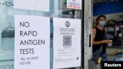 A pharmacy displays a sign to inform customers that Rapid Antigen Test kits are sold out in wake of COVID-19 in Sydney, Jan. 5, 2022.