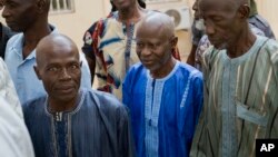 Ousainou Darboe, the head of the United Democratic Party (C), arrives with 18 others for a hearing at Gambia's supreme court in Banjul, Dec. 5, 2016. They had been arrested in April after they took part in a peaceful demonstration and sentenced to three years in prison.