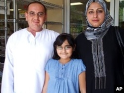 Iraqi Wisam Alani, his wife and their nine-year-old daughter attend midday prayer service at the ADAMS center mosque, 13 Aug 2010