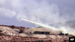 Turkish artillery fires toward Syrian Kurdish positions in Afrin area, Syria, from Turkish side of the border in Hatay, Turkey, Feb. 9, 2018. Turkish jets have resumed airstrikes in the Syrian Kurdish-run enclave of Afrin, military and media reports said Friday. 