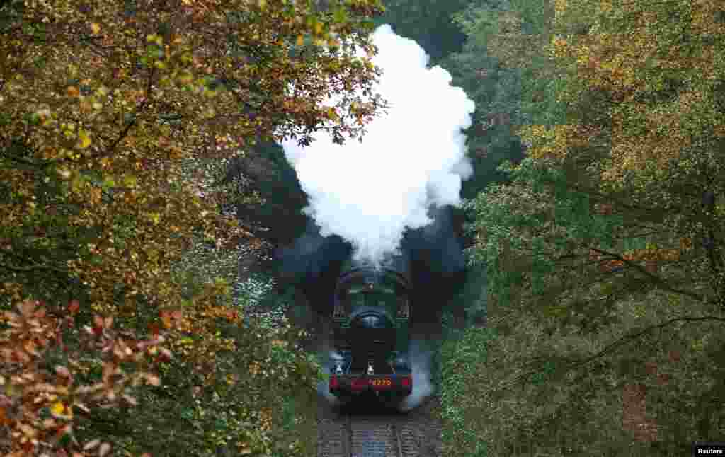 A steam train travels along the East Lancashire Railway&#39;s line near Summerseat station during the Autumn Steam Gala event near Bury, northern England, Britain.