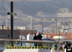 FILE - Pope Francis stands, looking across the Rio Grande towards Texas along the US-Mexico border, in Cuidad Juarez, Mexico, Feb. 17, 2016.