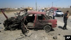 Hiện trường vụ đánh bom xe hơi tại 1 trạm xăng ở thành phố Kirkuk, 10/7/2014.