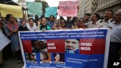 Supporters of Pakistani civil society groups protest in favor of the Christian community in Karachi, Pakistan, Feb. 26, 2018. An official said Sajid Masih, a Christian blasphemy suspect, who suffered serious injuries after jumping off a federal building, is now in stable condition. 