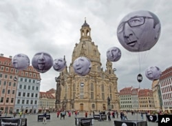 Activists of the international campaigning and advocacy organization ONE installed balloons with portraits of the G7 heads of state in front of the Frauenkirche cathedral (Church of Our Lady) prior to the G7 Finance Ministers meeting in Dresden, eastern G