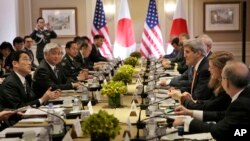 Japanese Foreign Minister Fumio Kishida, left, and Defense Minister Gen Nakatani, second from left, attend a meeting with U.S. Secretary of State John Kerry, third from right, and Secretary of Defense Ashton Carter, not visible, in New York, April 27, 2015.