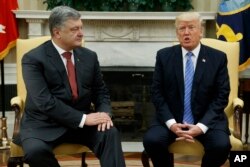 President Donald Trump, right, speaks during a meeting with Ukrainian President Petro Poroshenko in the Oval Office of the White House, in Washington, June 20, 2017.