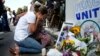 FILE - A woman reacts at a make shift memorial outside the Al-Noor mosque in Christchurch, New Zealand, March 23, 2019.