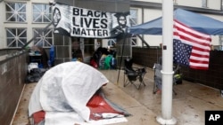 Members of Black Lives Matter continue their encampment outside the Minneapolis Police Department's Fourth Precinct, Nov. 17, 2015.