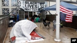 Members of Black Lives Matter continue their encampment outside the Minneapolis Police Department's Fourth Precinct, Nov. 17, 2015.