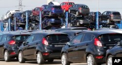 Ford cars wait for unloading after arrival by ship at the Ford Dagenham diesel engine plant in London, July 21, 2017.