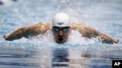 Michael Phelps competes in the 100-meter butterfly at the Indianapolis Grand Prix swimming meet in Indianapolis on March 29, 2012. 