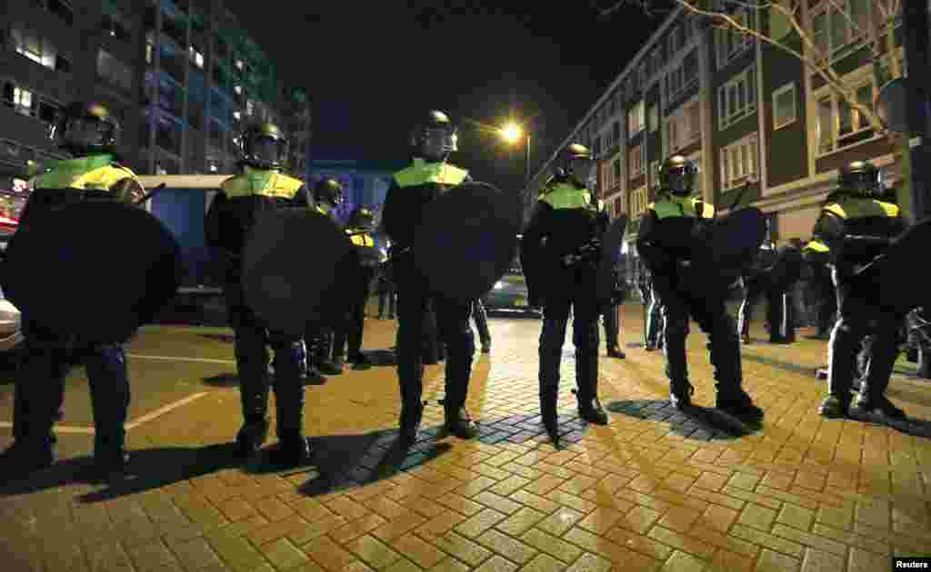 Police block off the street outside the Turkish consulate in Rotterdam where a crowd gathered to await the arrival of the Turkish Family Minister Fatma Betul Sayan Kaya, who decided to travel to Rotterdam by land after Turkish Foreign Minister Mevlut Cavu