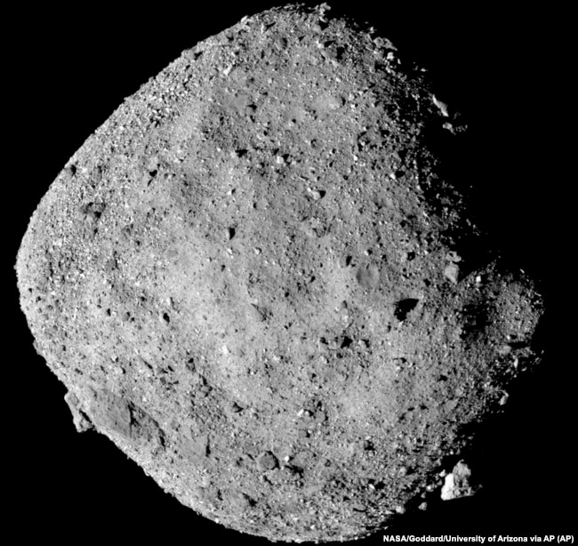 This mosaic image made from 12 PolyCam images collected on December 2, 2018, and provided by NASA shows the asteroid Bennu.
