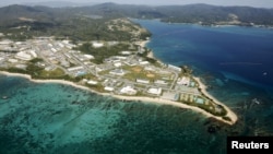 FILE - Coral reefs are seen along the coast near the U.S. Marine base Camp Schwab, off the tiny hamlet of Henoko in Nago on the southern Japanese island of Okinawa, October 29, 2015. Japan's government is supporting a candidate backed by the ruling party to win the mayoral election in the Okinawan city.