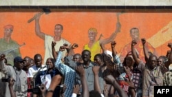 Opposition leaders gather during a protest at the Place de la Nation in Burkina Faso's capital Ouagadougou, calls for the departure of the military, Nov. 2, 2014.