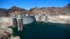 FILE - The low level of the water line is shown on the banks of the Colorado River at the Hoover Dam in Hoover Dam, Arizona, May 31, 2018.