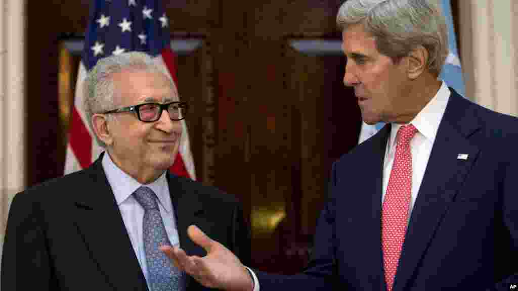 U.N-Arab League envoy for Syria Lakhdar Brahimi listens as U.S. Secretary of State John Kerry speaks after their meeting in London, Oct. 14, 2013. 