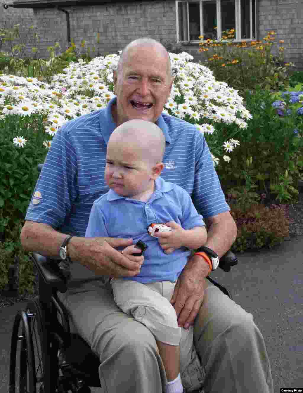 Former U.S. President George H.W. Bush pictured with Patrick, the son of a member of his security detail who is suffering from leukemia. Bush and his security team shaved their heads in support of Patrick, whose last name has been withheld. (Photo credit: Office of George HW Bush)
