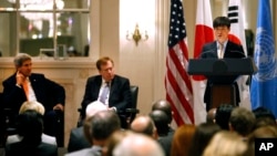 FILE - Secretary of State John Kerry, left, and State Department special envoy Robert King, center, listen as North Korean human rights activist Shin Dong-hyuk delivers remarks. 