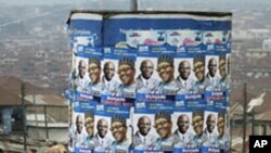 An advertisement tank is plastered with posters of former military ruler Muhammadu Buhari and his running mate Tunde Bakare during the Congress for Progressive Change (CPC) presidential campaign rally at Mapo square, Ibadan, south-west Nigeria, Mar 14 20
