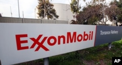 FILE - A sign for the ExxonMobil Torerance Refinery in Torrance, California, Jan. 30, 2012