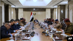 Kryeministri irakian al-Khadhimi duke drejtuar mbledhjen (7 nëntor 2021, AP)