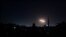 Light in the sky is seen in Damascus, Syria, in this handout released by SANA on Feb. 24, 2020. 