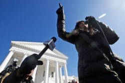 FILE - Jan Morgan, National Founder 2A Women, speaks during a pro gun rally in front of the Virginia State Capitol, Jan. 20, 2020, in Richmond, Va.