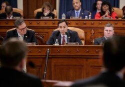 FILE - House Intelligence Committee member Rep. Joaquin Castro, D-Texas (center) flanked by Rep. Denny Heck, D-Wash. (left) and Rep. Rick Crawford, R-Ark., at a hearing on Capitol Hill in Washington, March 20, 2017.