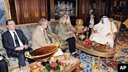 In this photo released by Saudi Press Agency, King Abdullah of Saudi Arabia, right, meets with Secretary of State Hillary Rodham Clinton, 3rd left, in Riyadh, Saudi Arabia, Friday, March 30, 2012.