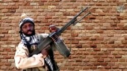FILE - Boko Haram leader Abubakar Shekau holds a weapon in an unknown location in Nigeria in this still image taken from an undated video obtained Jan. 15, 2018.