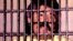 UNDATED FILE PHOTO - Mexican drug lord Rafael Caro Quintero is shown behind bars in this undated file photo. Quintero won an initial appeal against his conviction and 40 year sentence for the 1985 murder of U.S. DEA agent Enrique Camarena. Quintero will s