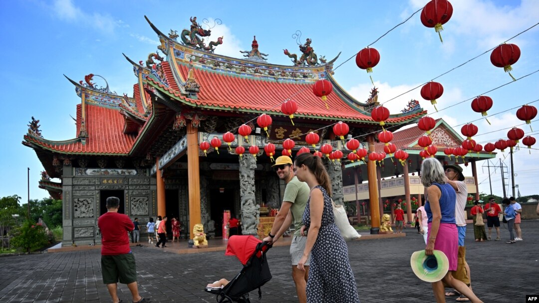 Tourists visit a temple on the first day of the Lunar New Year of the Snake in Denpasar, Indonesia's Bali island, on Jan. 29, 2025.