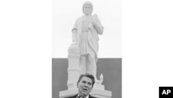 FILE - In this Oct. 9, 1984, photo, President Ronald Reagan addresses a ceremony in Baltimore, to unveil a statue of Christopher Columbus. 