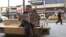 A man reads a newspaper as he sits on a bench in Sur district of the Kurdish-dominated southeastern city of Diyarbakir, Turkey, Oct. 30, 2015. 