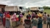 People affected by Cyclone Jude wait for relief items in Mulanje district, Malawi, on March 13, 2025.