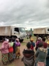 People affected by Cyclone Jude wait for relief items in Mulanje district, Malawi, on March 13, 2025.