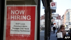 FILE - A now-hiring sign is posted in the window of a Walgreens store in San Francisco, California, June 6, 2019.