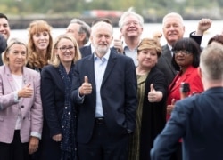 Britain's opposition Labour Party leader Jeremy Corbyn poses with members of his shadow cabinet following their meeting in Salford, Britain, Sept. 2, 2019.