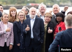 Britain's opposition Labour Party leader Jeremy Corbyn poses with members of his shadow cabinet following their meeting in Salford, Britain, Sept. 2, 2019.