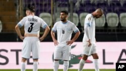 FILE—Israel players react at the end of the Euro 2024 qualifying play-off soccer match between Israel and Iceland, at Szusza Ferenc Stadium in Budapest, Hungary, March 21, 2024.