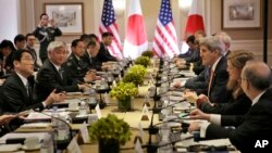 Japanese Foreign Minister Fumio Kishida, left, and Defense Minister Gen Nakatani, second from left, attend a meeting with U.S. Secretary of State John Kerry, third from right, and Secretary of Defense Ashton Carter, not visible, in New York, April 27, 201